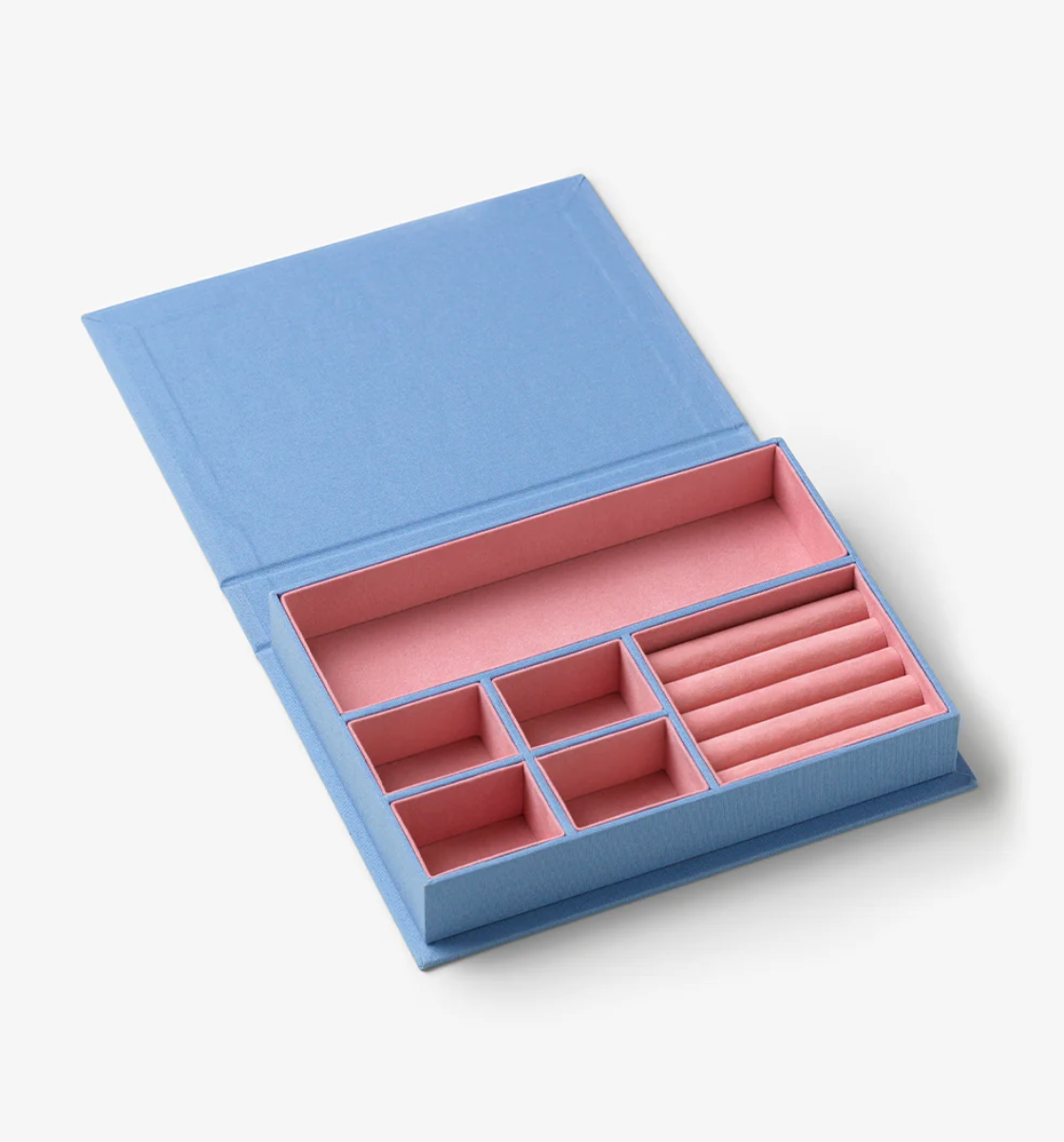 Blue jewelry box with pink interior compartments on a white background