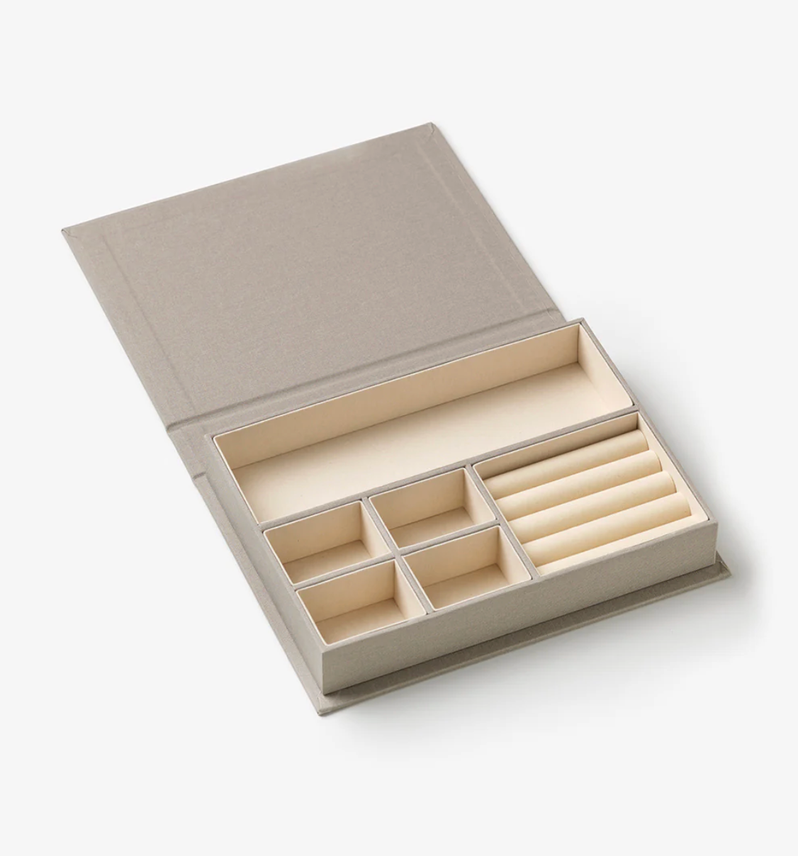 Beige jewelry box with compartments on a white background
