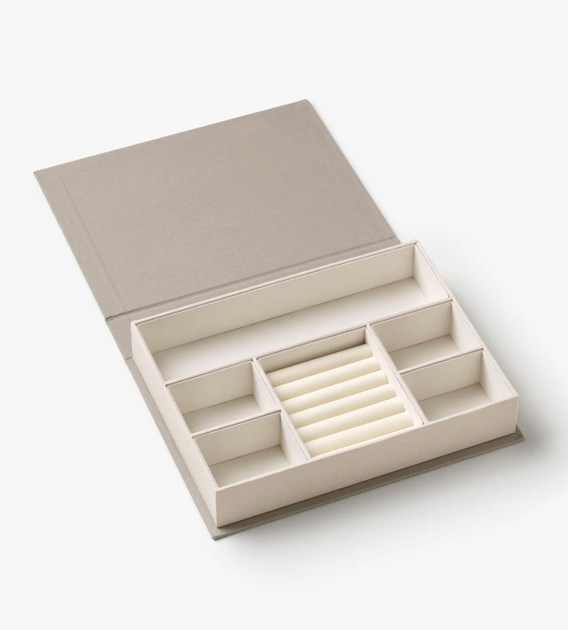 Open beige jewelry box with compartments on a white background