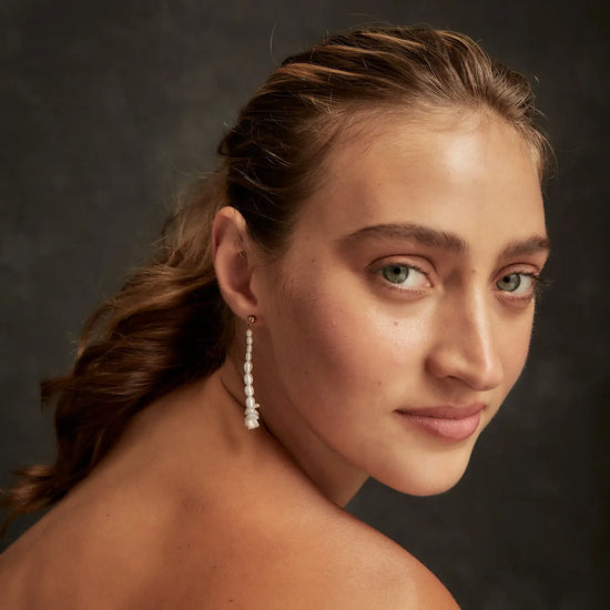 model wearing the organic pearl strand earrings