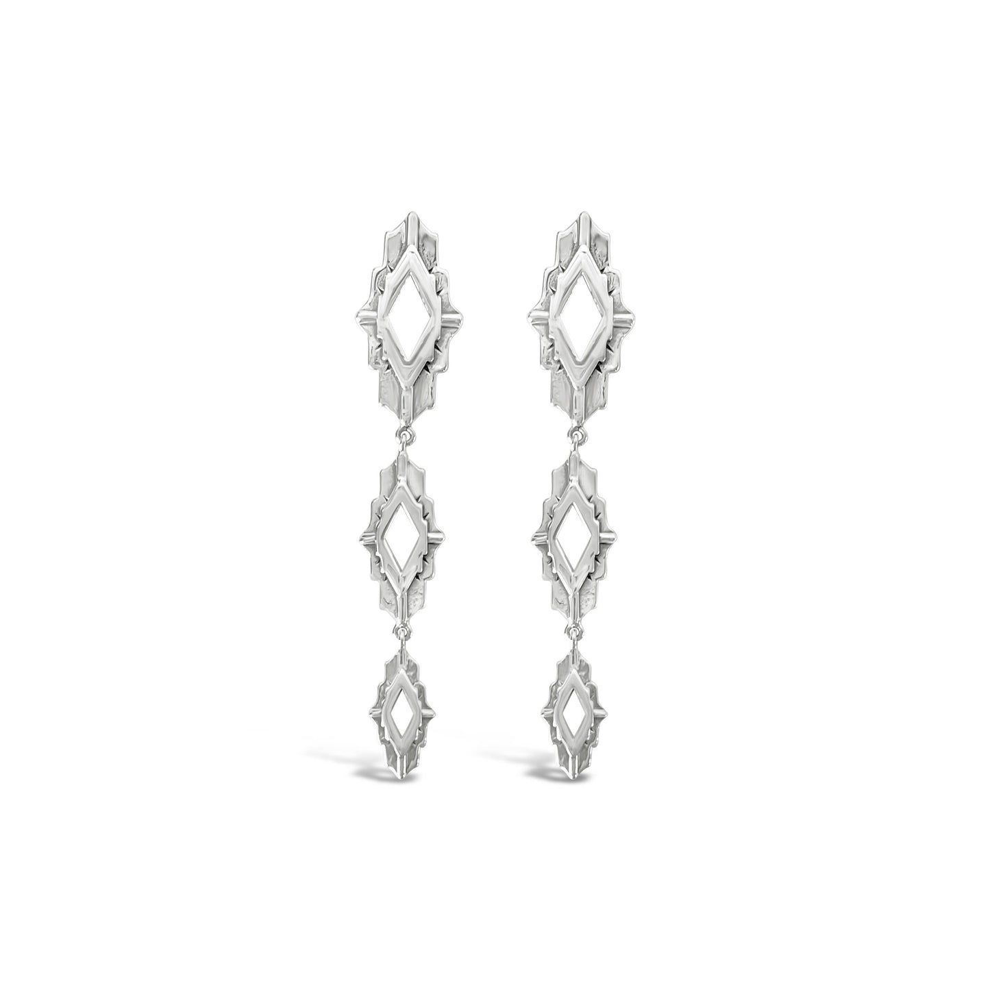 Pair of silver earrings on a white background