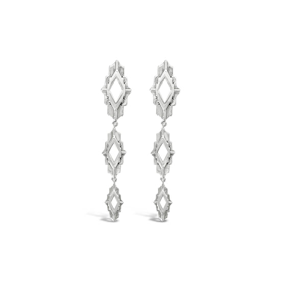 Pair of silver earrings on a white background