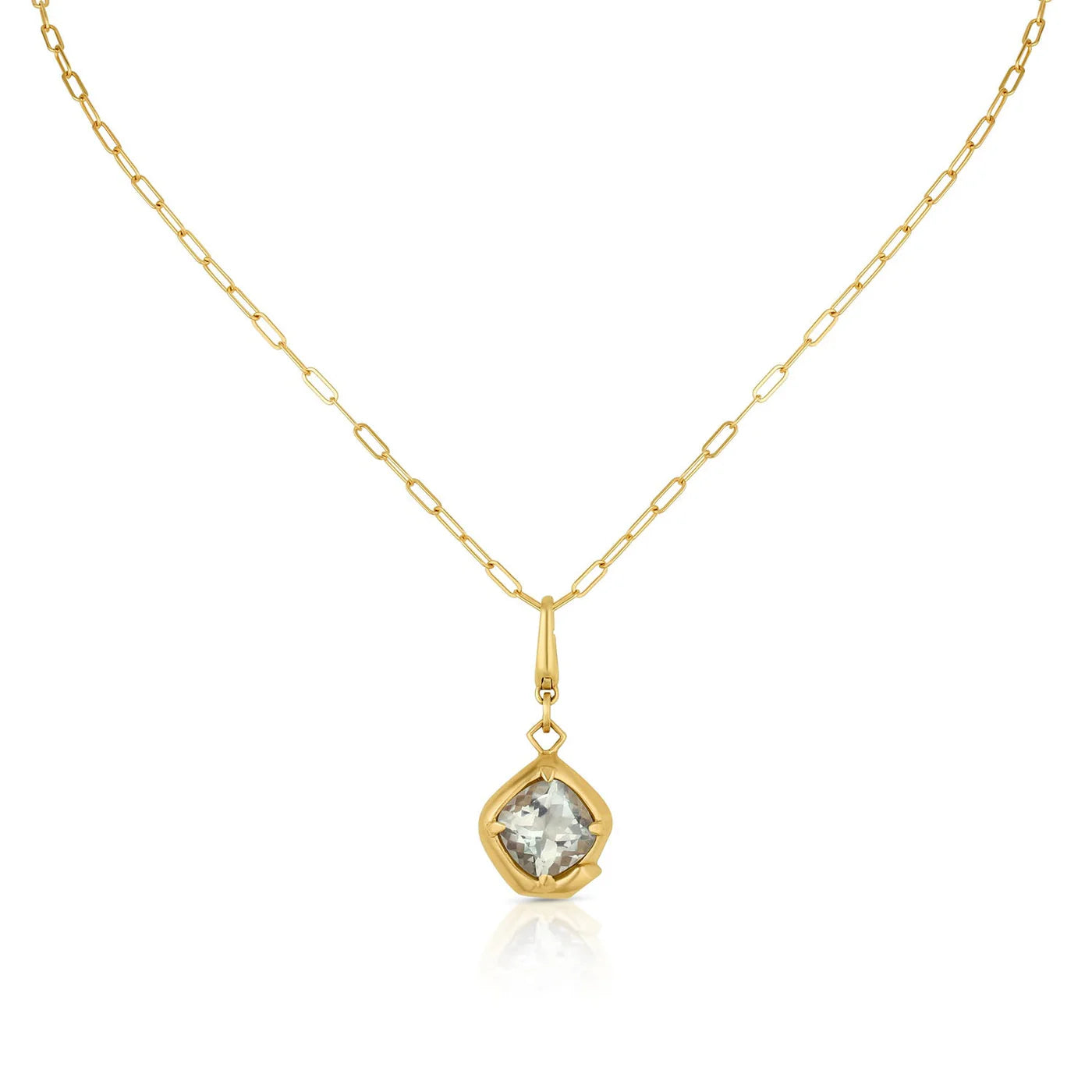 Gold necklace with a pendant featuring a light green gemstone on a white background