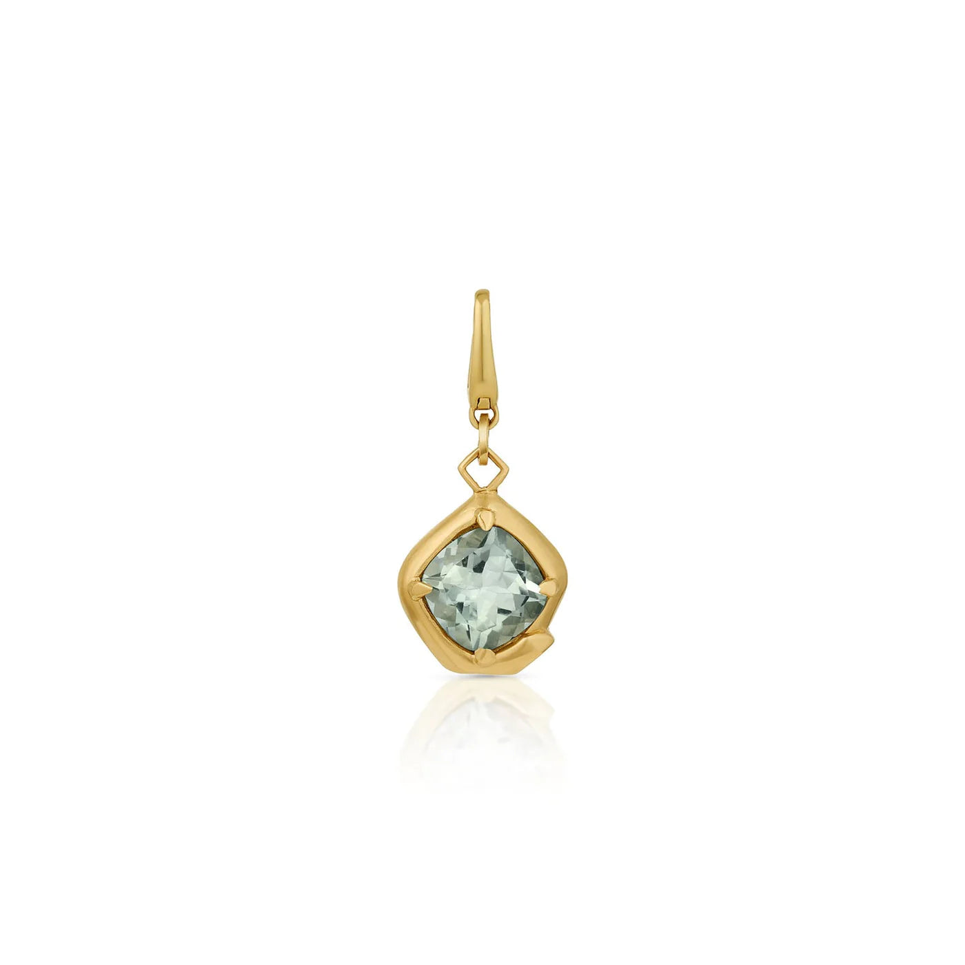Gold pendant with a green gemstone on a white background