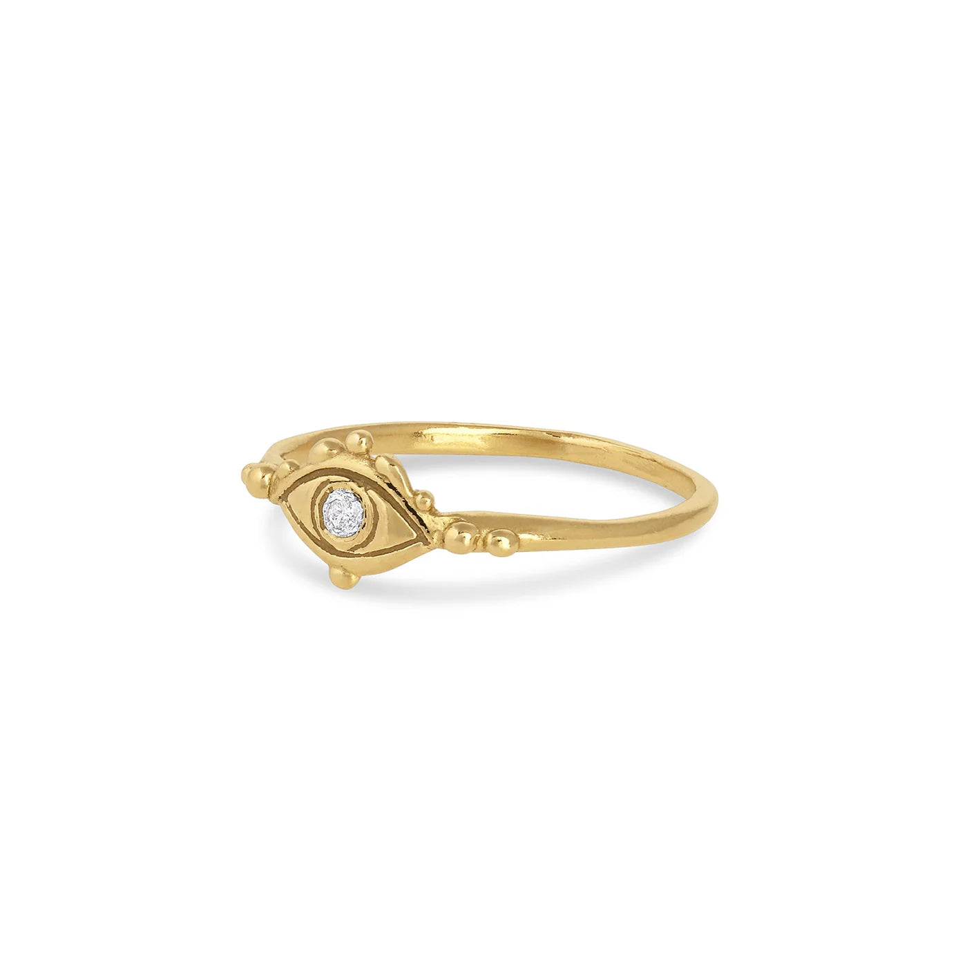 Gold ring with an eye design on a white background