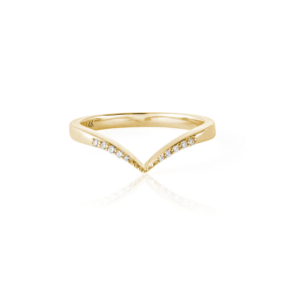 yellow gold v shaped band on a white background