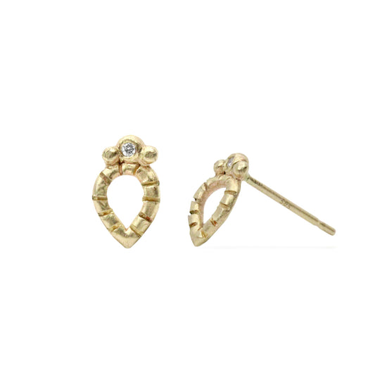 Load image into Gallery viewer, side angle picture of gold petal shaped earrings pictured on white background 

