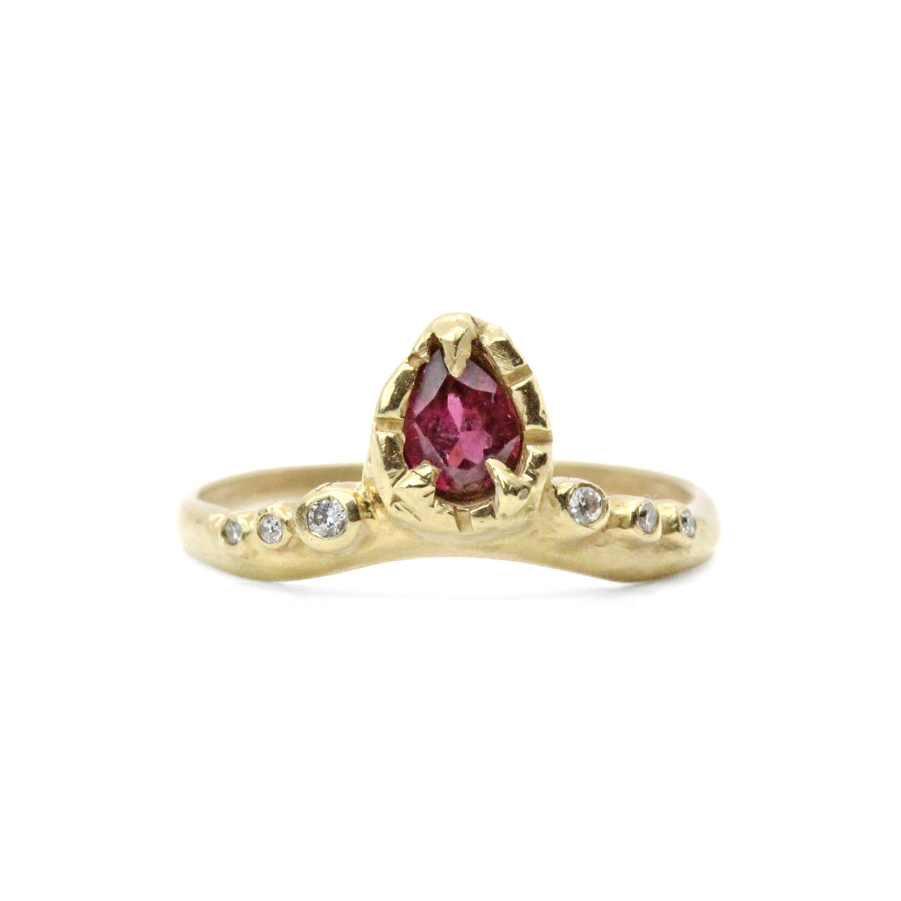 Gold, pear cut diamond ring pictured on white background