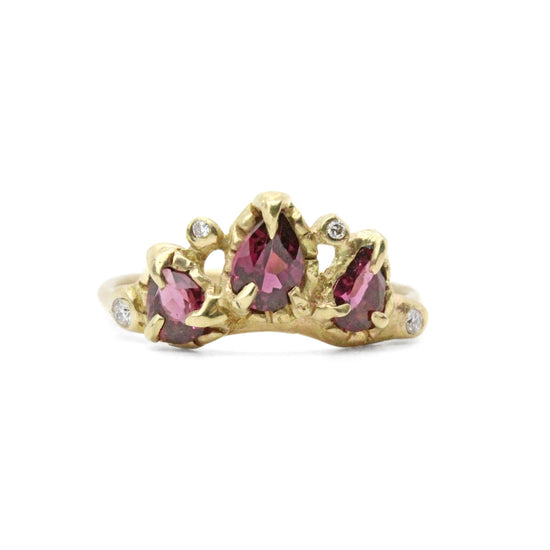 Load image into Gallery viewer, gold ring with 3 rasberry colored garnets, surrounded by smaller diamonds pictured on white background

