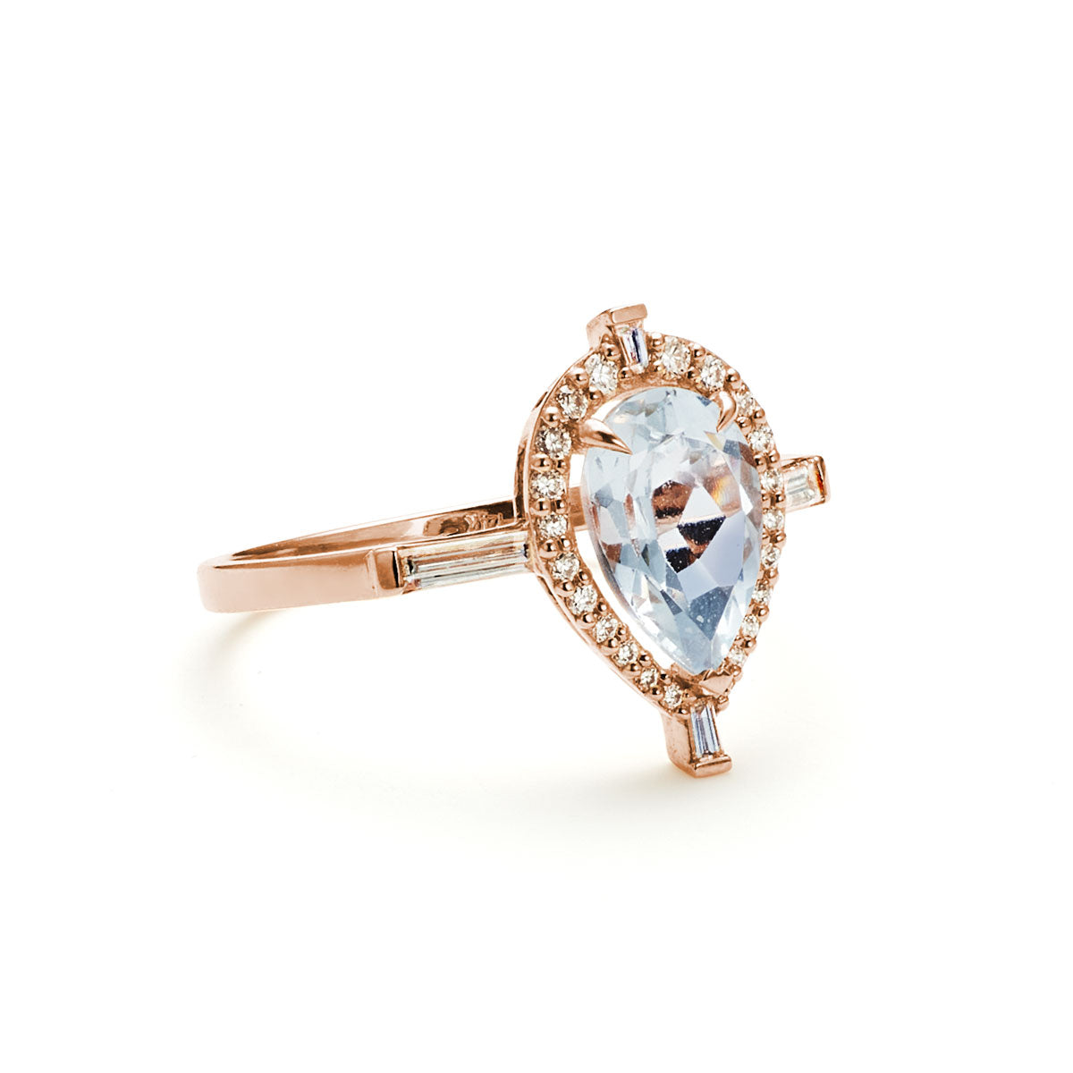 Angled view of the Pear shaped aquamarine diamond Marchesa ring on white background.