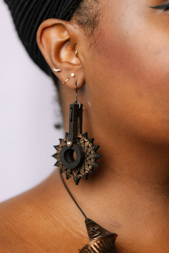 Starport earrings on model
