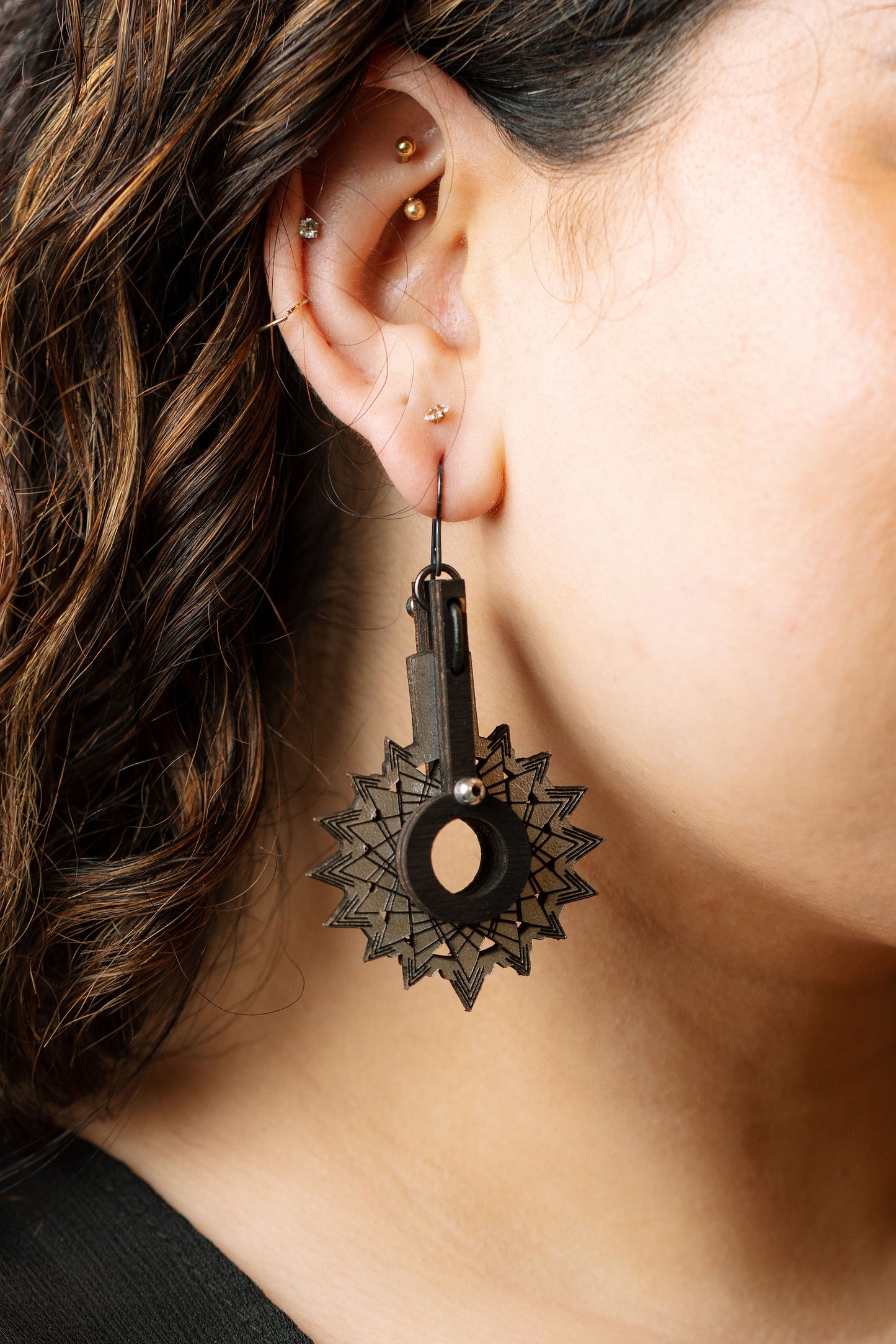 Starport earrings on model