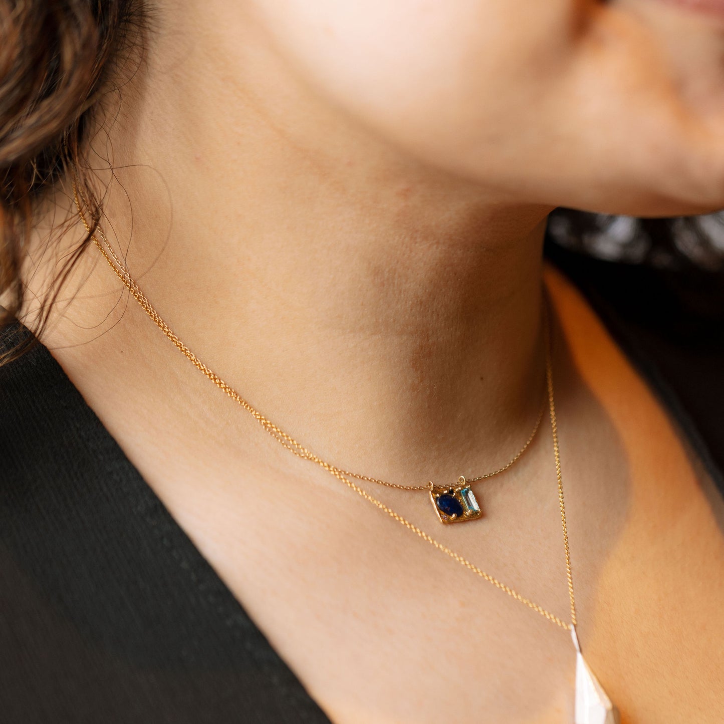 Blue drop collage necklace on model