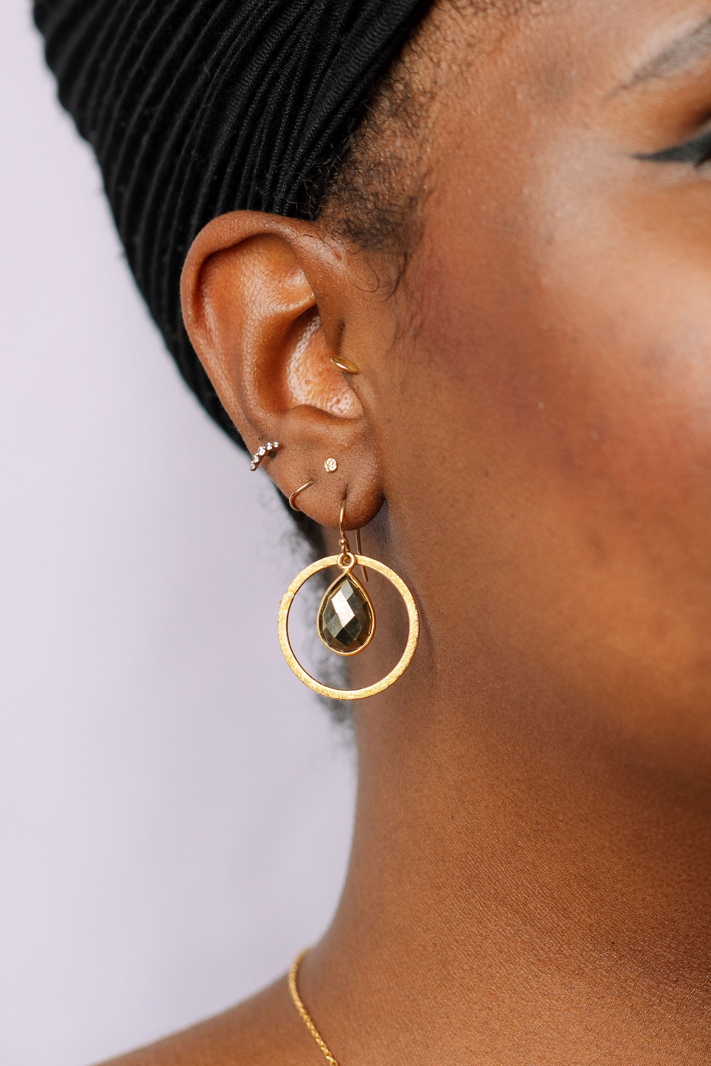 Load image into Gallery viewer, Gold pyrite earrings on model
