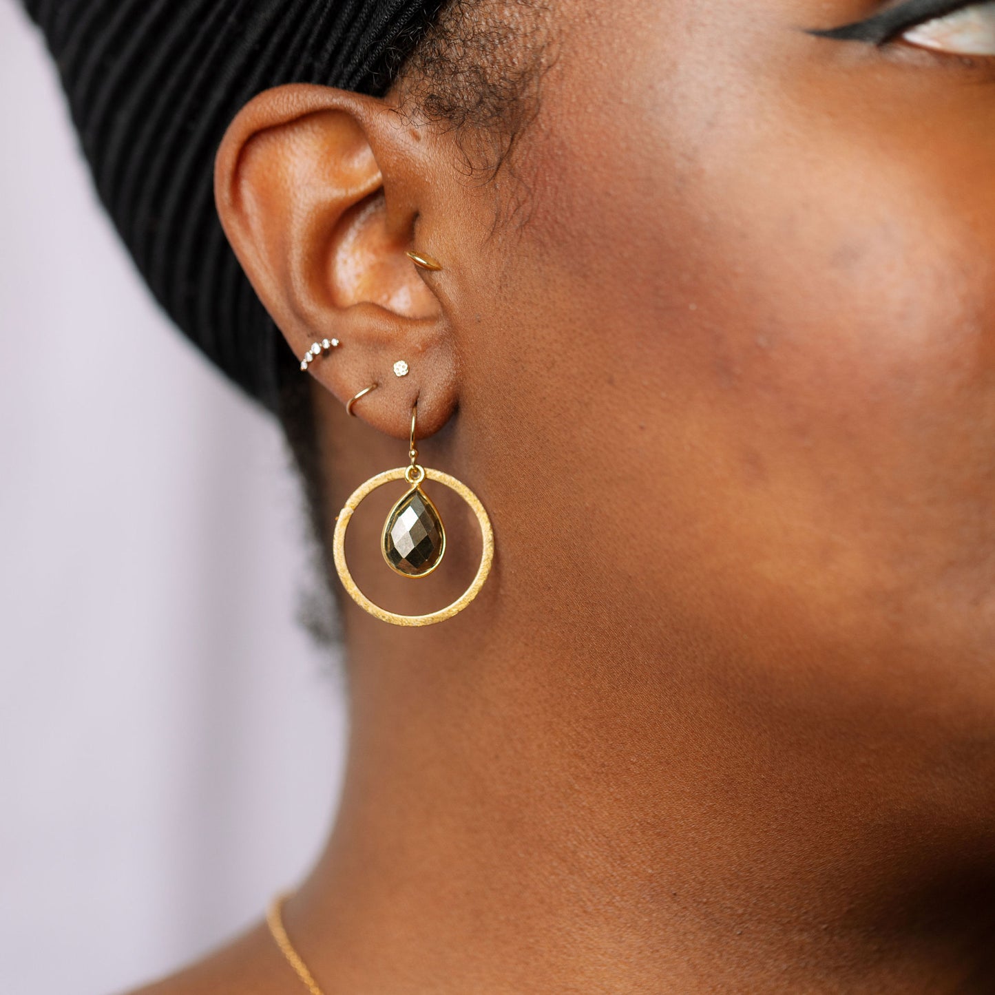 Load image into Gallery viewer, Gold pyrite earrings on model
