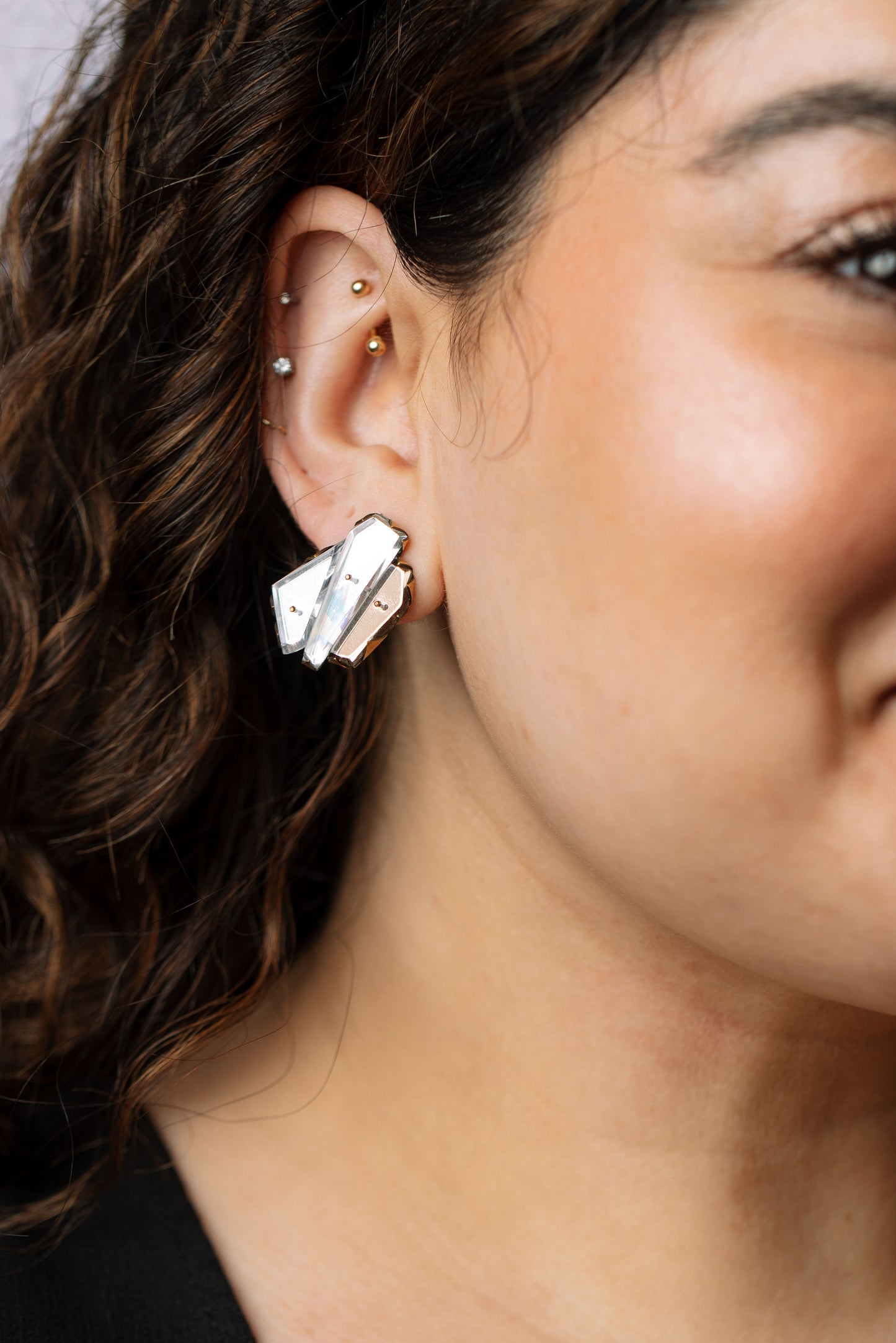Silver gem studs on model