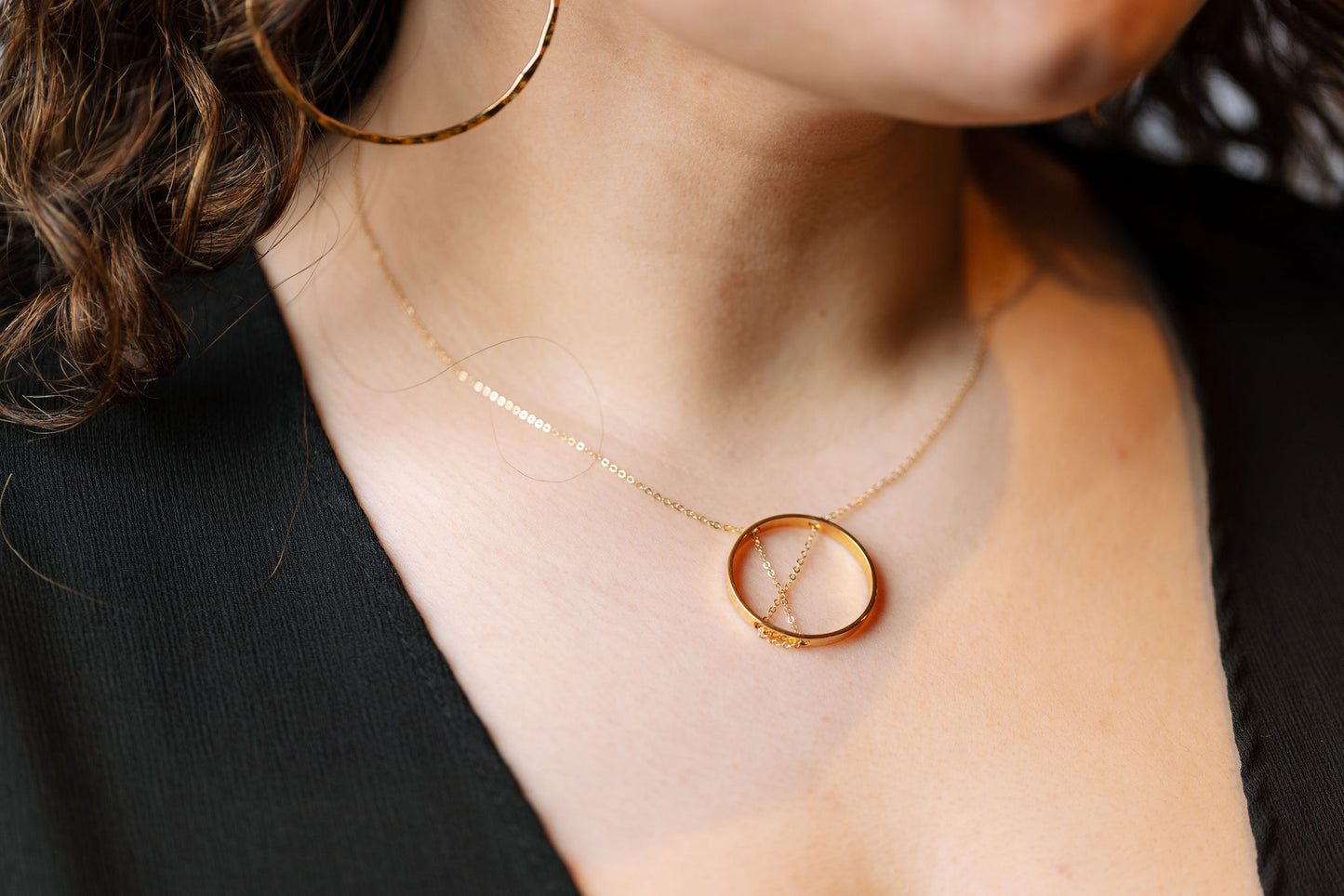 Gold inner circle necklace on model