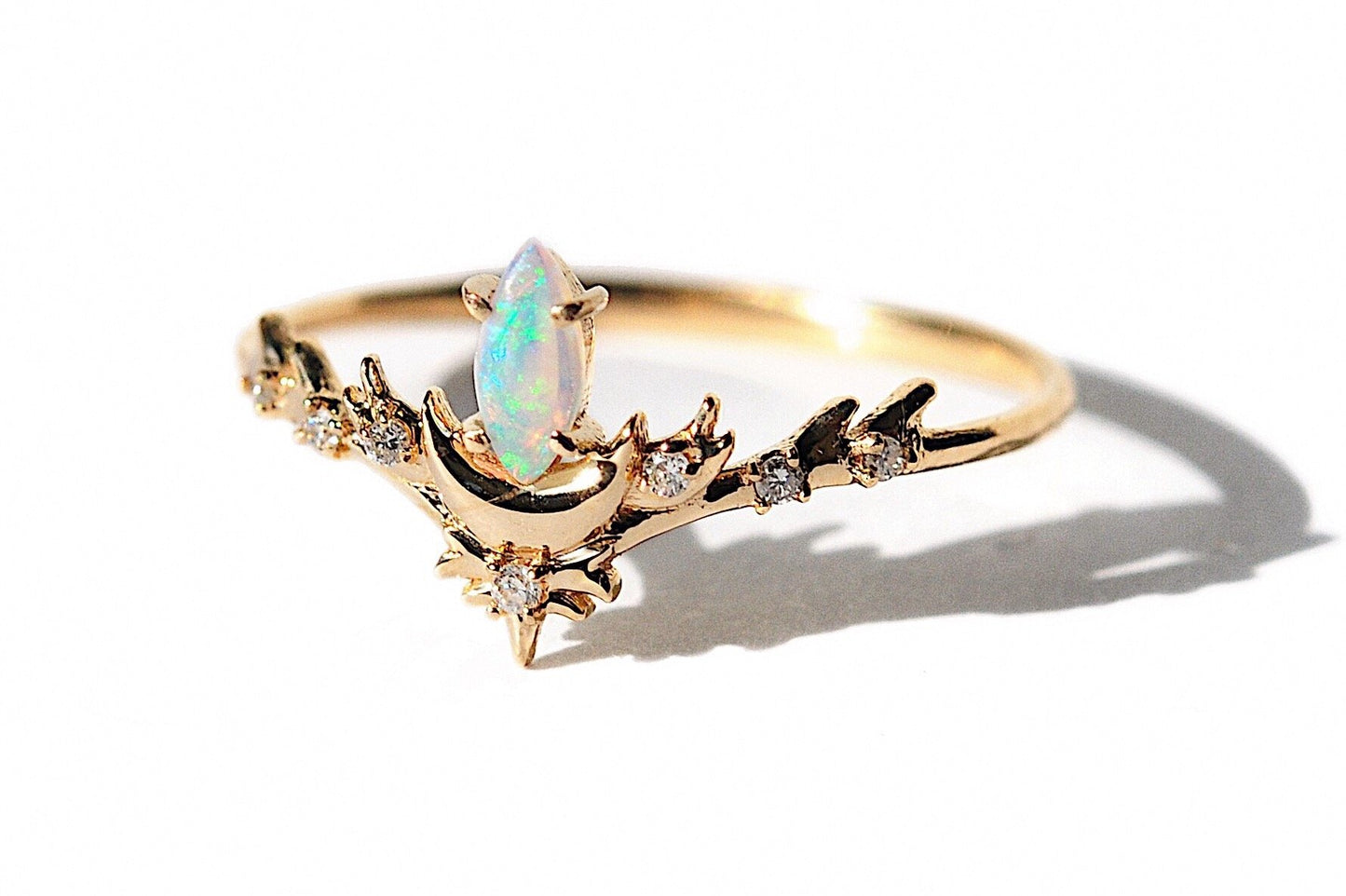 Opal Marquise Luna Diamond Ring close up on white background.
