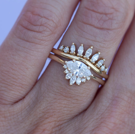 Load image into Gallery viewer, White diamond sideways set marquise gold ring with diamond crown, stacked with diamond band on a hand.
