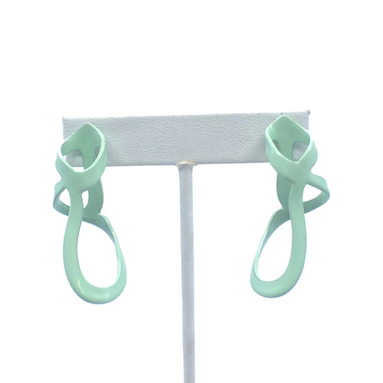 Mint sculptural woven drip earrings, on earring stand with white background.