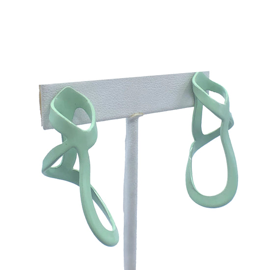 Mint sculptural woven drip earrings, on earring stand with white background.