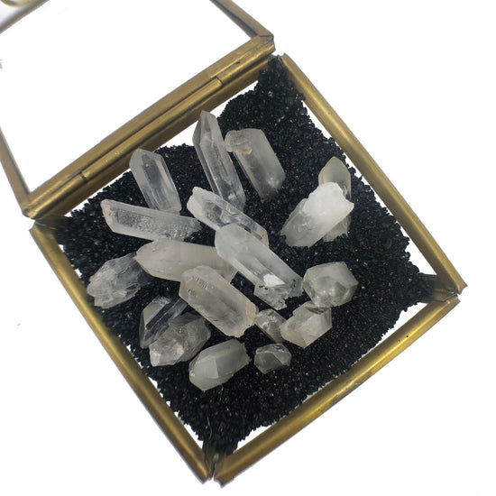 Glass box full of clear quartz.