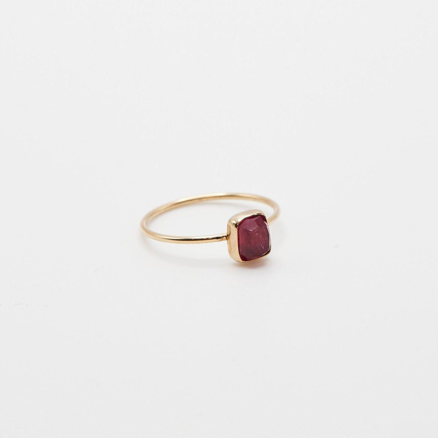 angled side view of the small rectangle pink tourmaline ring