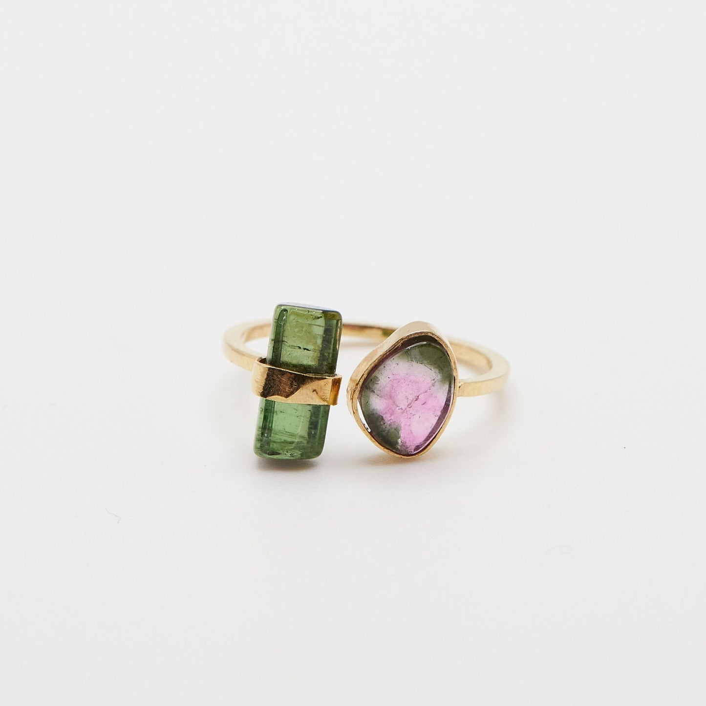 split green and watermelon tourmaline ring on white background