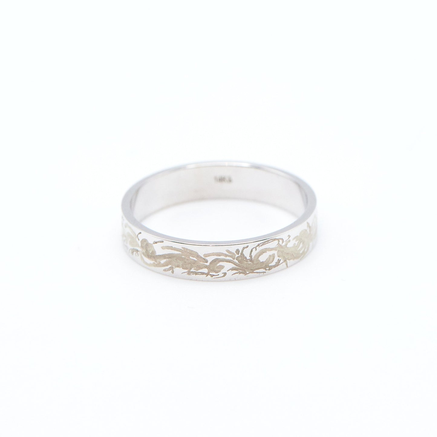 Load image into Gallery viewer, white gold 4mm wide flat band with hand engraving design on white background
