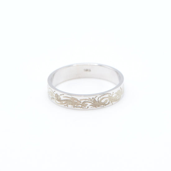 Load image into Gallery viewer, white gold 4mm wide flat band with hand engraving design on white background

