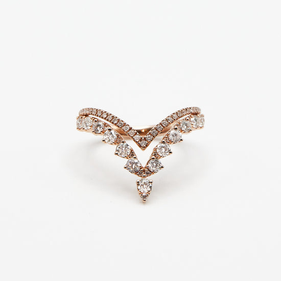 rose gold v shaped back with two vs and multiple shaped diamonds on white background