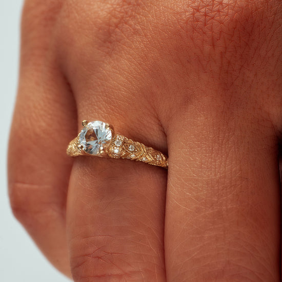 Load image into Gallery viewer, Josephine ring with white sapphire center stone on hand model.
