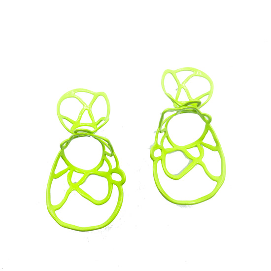 Chartreuse sculptural double lace statement earrings on white background.