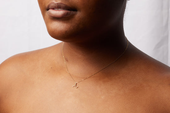 model wearing the A initial necklace