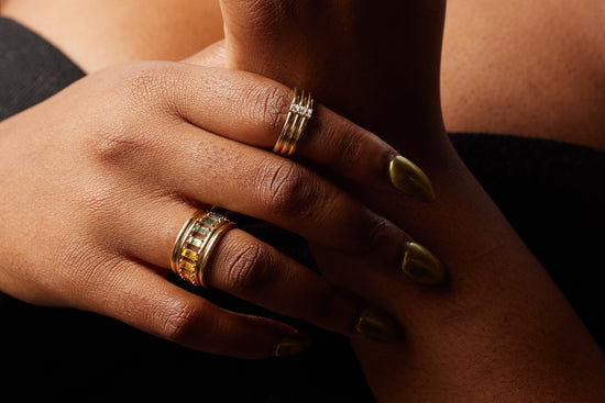model wearing the rainbow revival column ring and the princess stack ring by jeanette park
