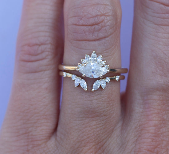 Load image into Gallery viewer, White diamond sideways set marquise ring with diamond crown, stacked on hand with open diamond band.
