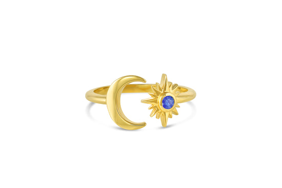 18k yellow gold crescent moon and star with blue sapphire center stone open ring on white background.
