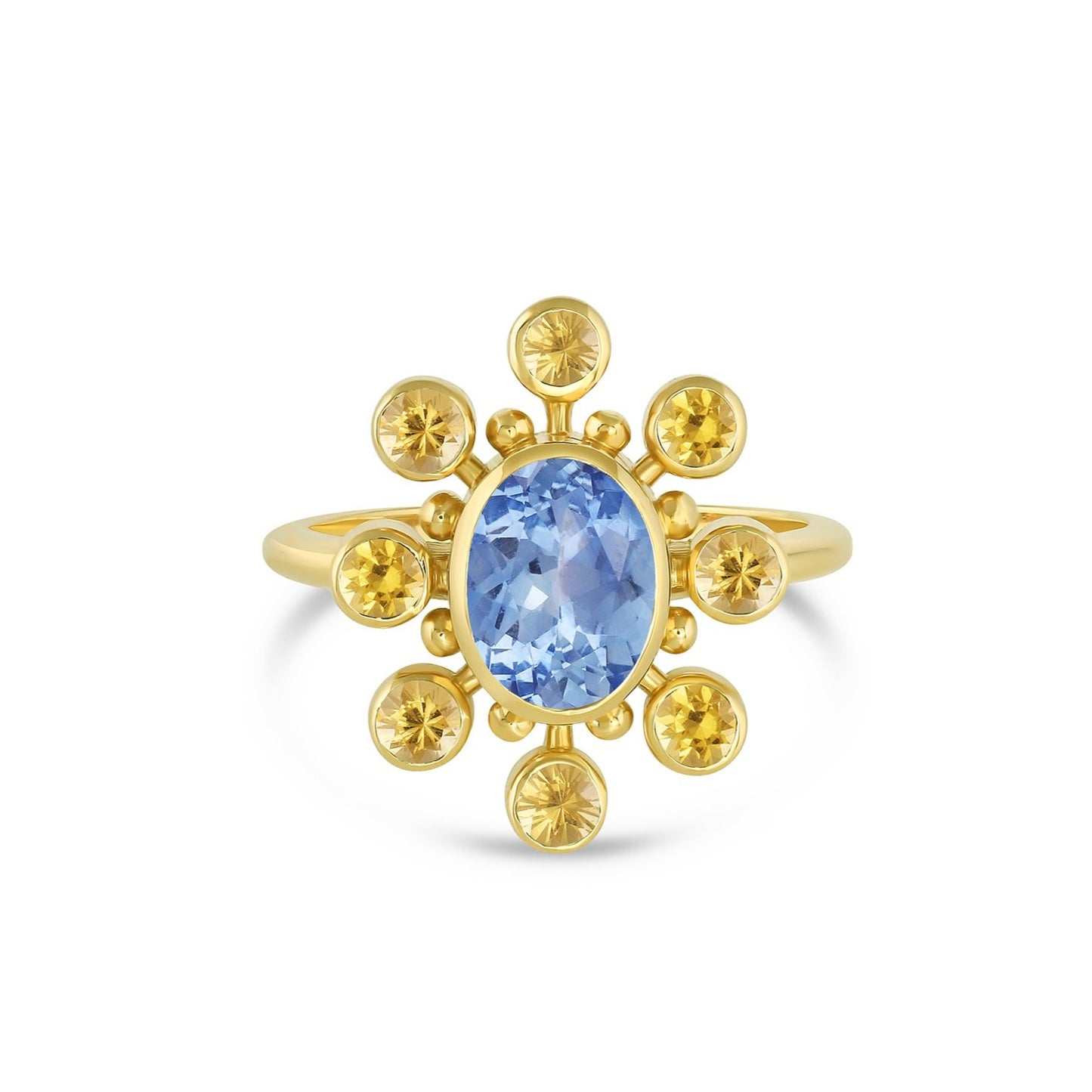 18k yellow gold cosmos ring with blue sapphire center stone and yellow sapphire and gold halo on white background.