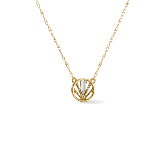 14k yellow gold, circle pendant with textural detail and baguette shaped diamond, close up on white background.