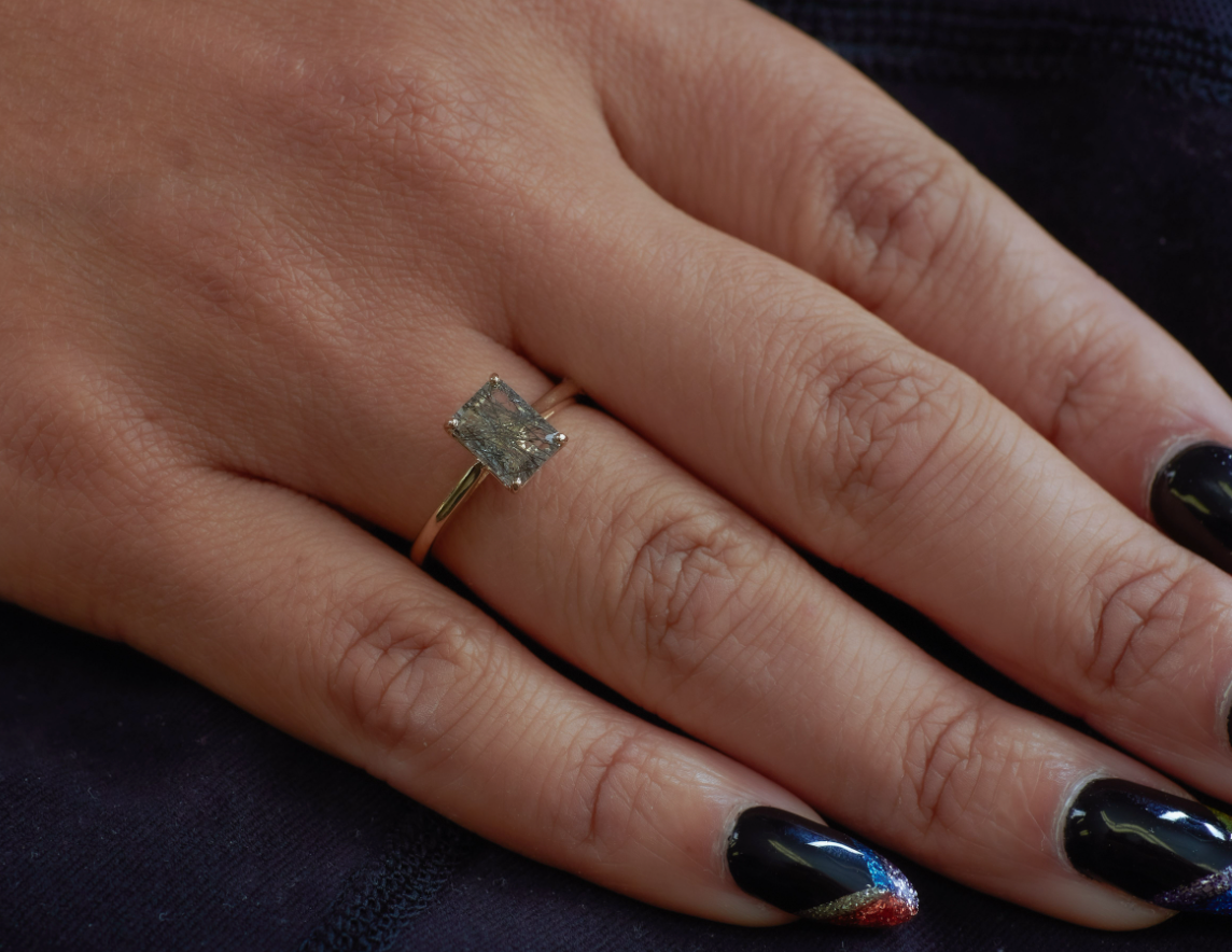 Hand modeling the Nico rutile quartz solitaire ring.