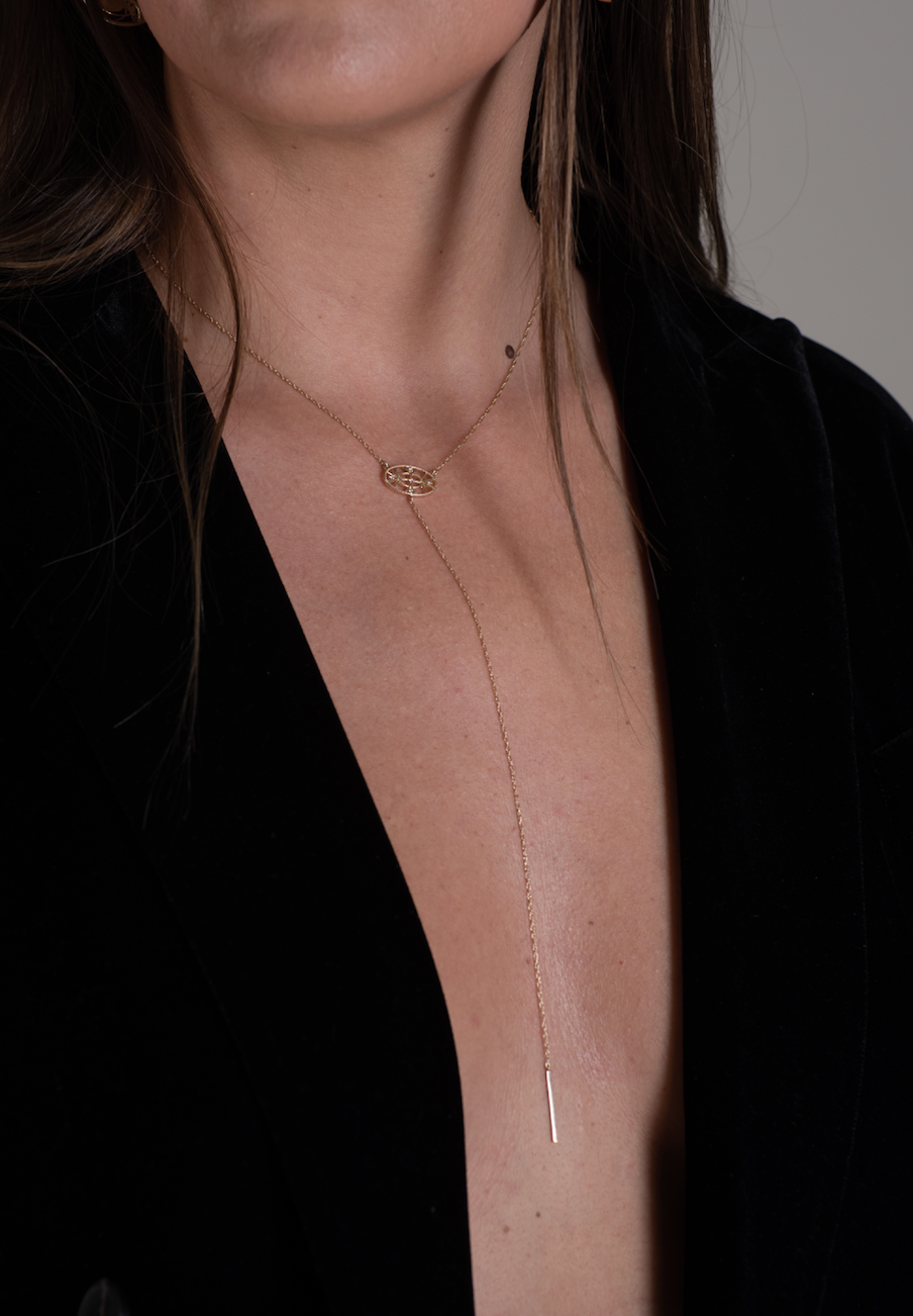 model wearing the yellow gold lariat drop necklace