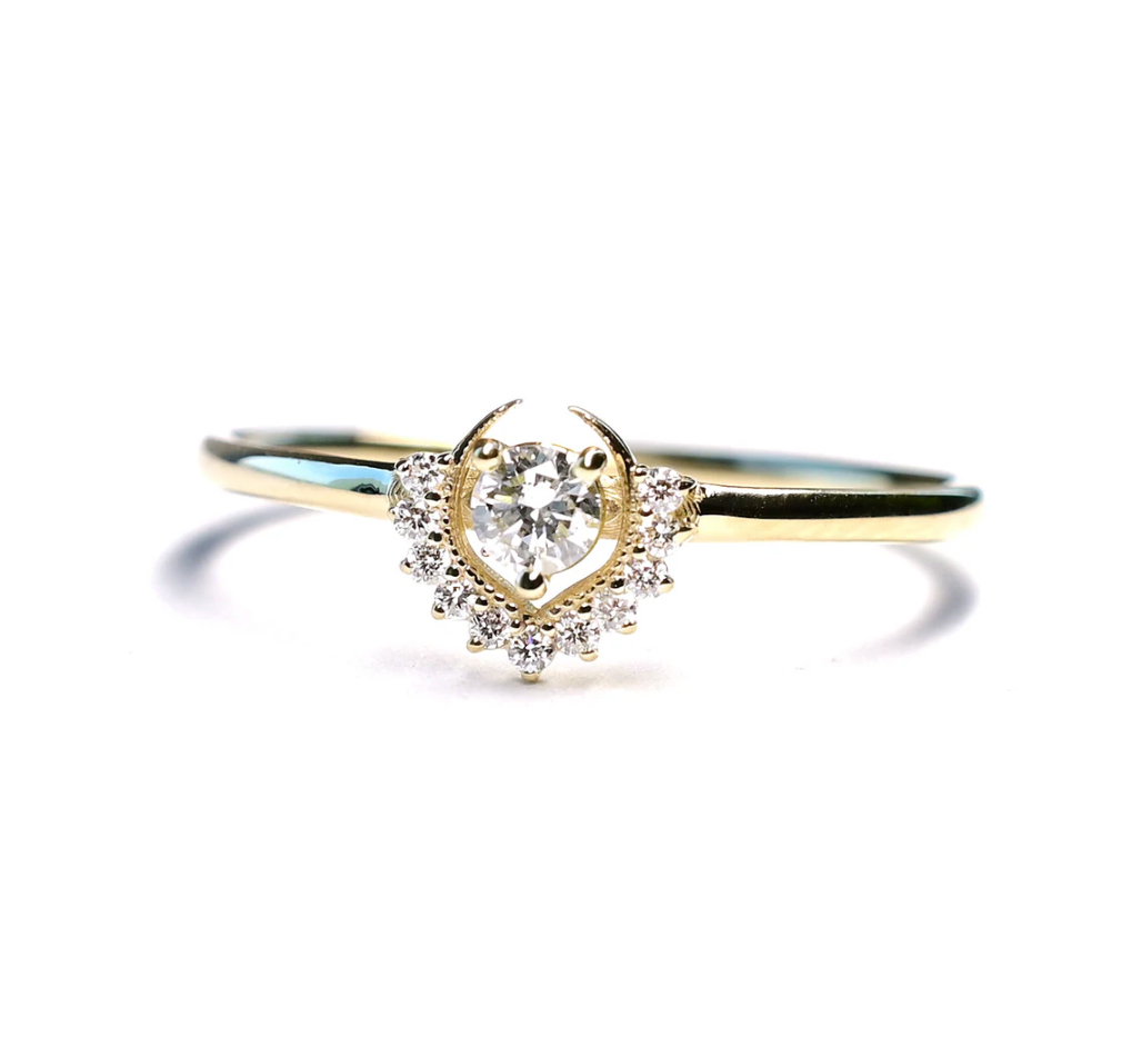 white diamond 14k yellow gold ring on white background