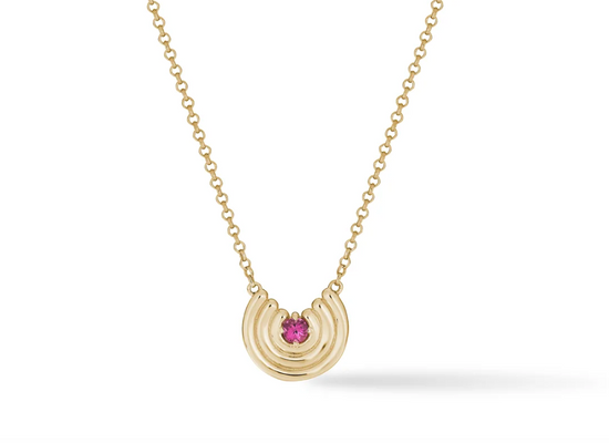 yellow gold curved pendant with pink tourmaline gemstone center on white background