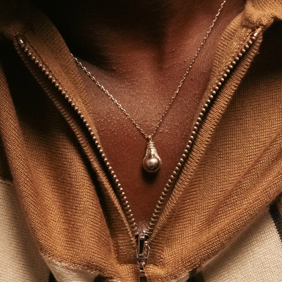 Load image into Gallery viewer, model wearing the lightbulb shaped pendant necklace
