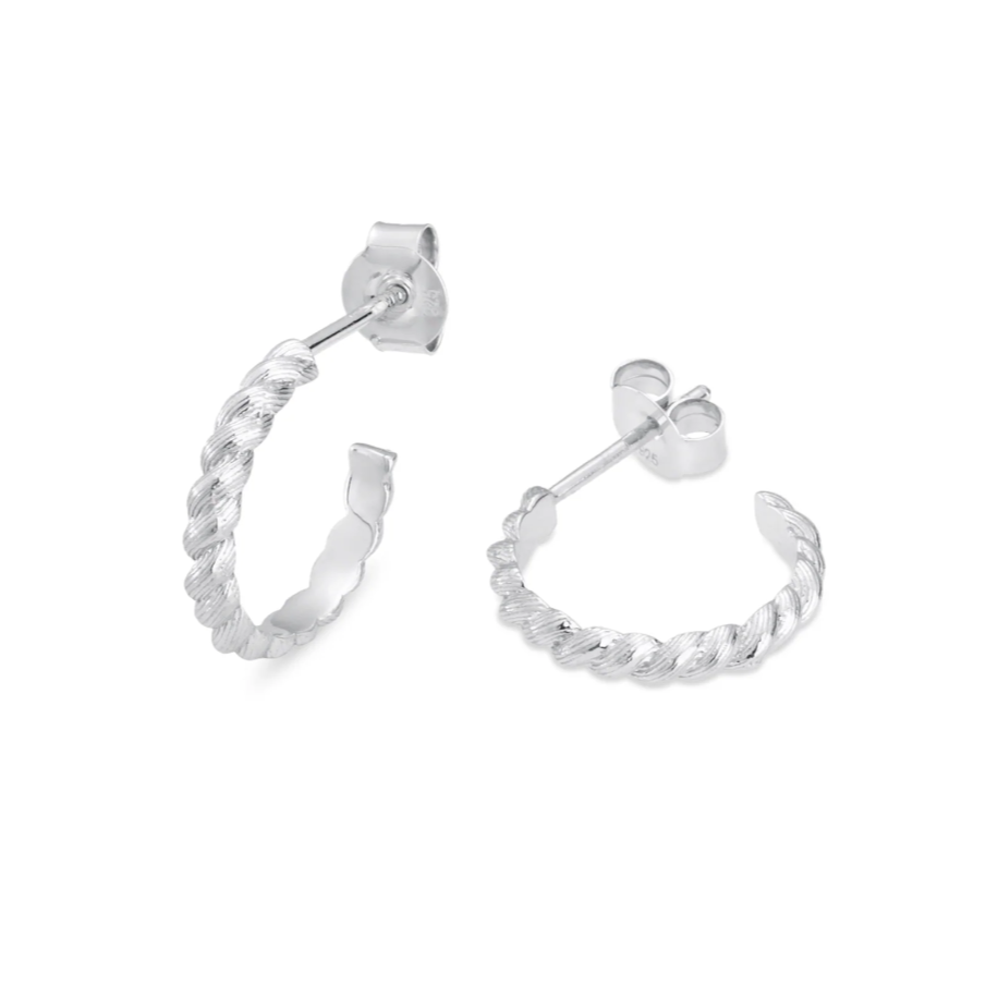 silver braided hoop earrings on white background