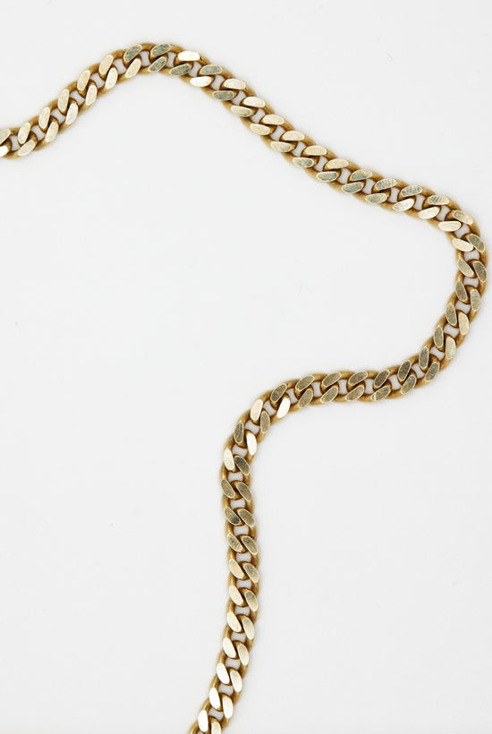 14k yellow gold curb chain on white background