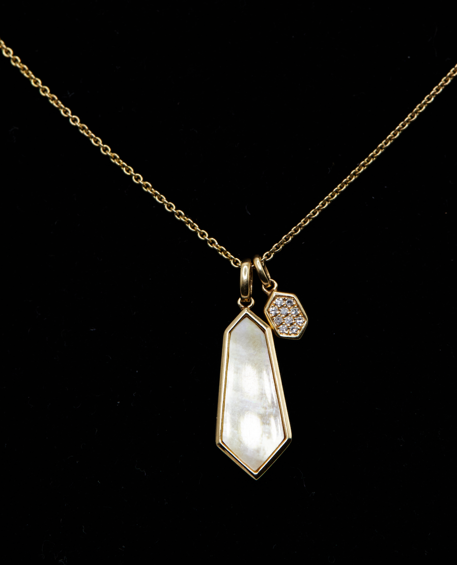 mother of pearl pendant necklace on black background