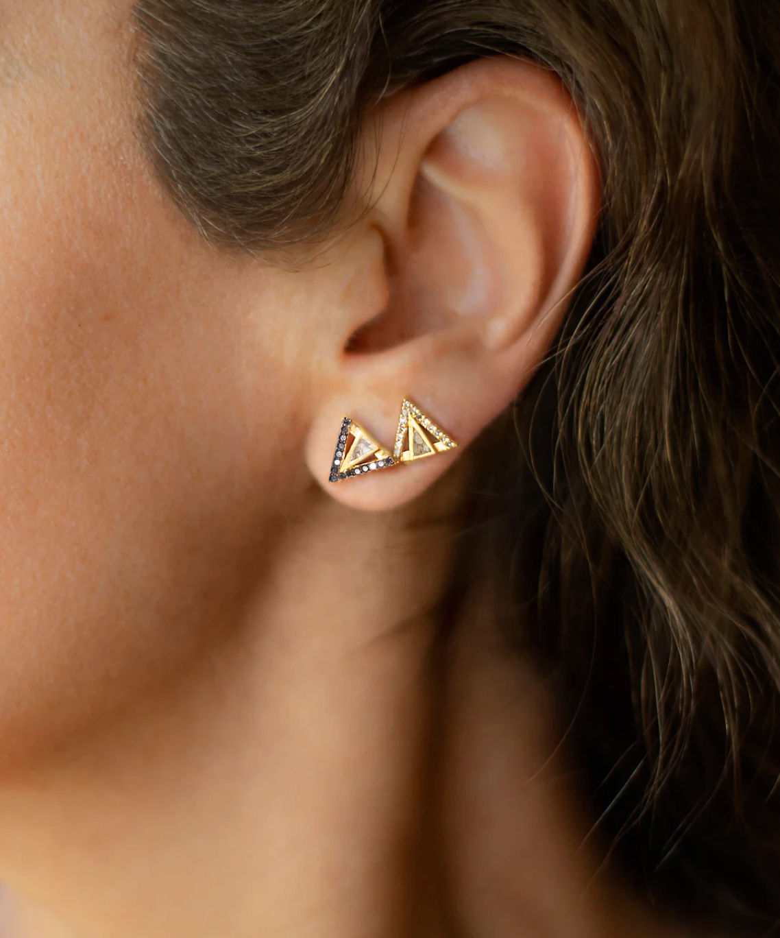 model wearing the black and champagne diamond enkel stud earrings