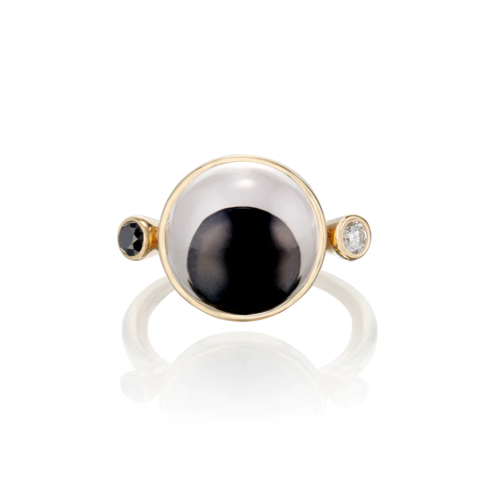 Load image into Gallery viewer, a gold ring with a black and white googly eye with a black and white diamond accent on each side. On a white background
