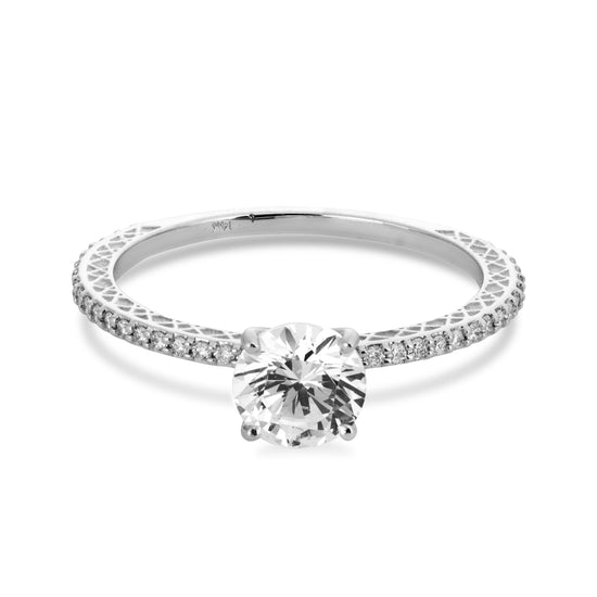 Viviana Langhoff's signature white gold diamond solitaire ring on white background.